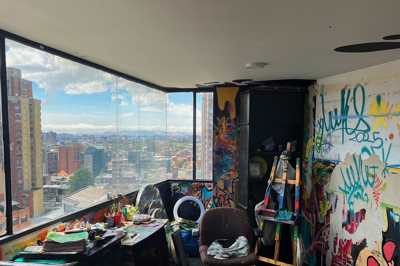 Inside LUKO’s studio, with paints and artworks